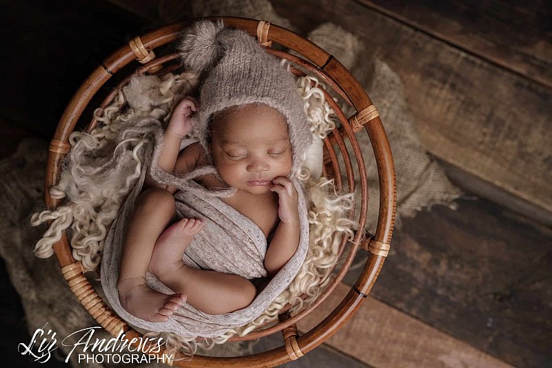 Newborn Baby in papasan chair