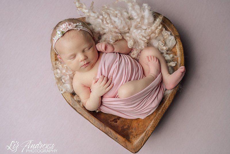 Newborn in a heart bowl