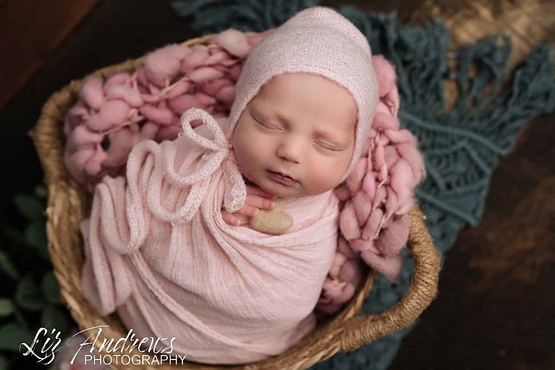 baby girl in a potato wrap
