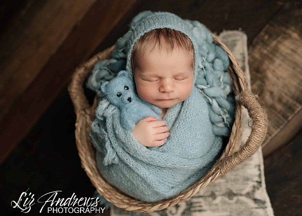 Baby boy in a basket